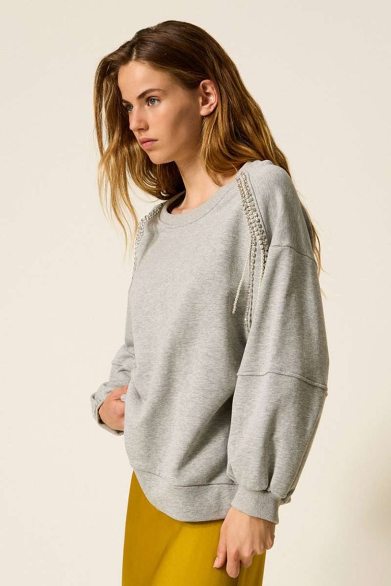 Felpa con catene di strass e perle