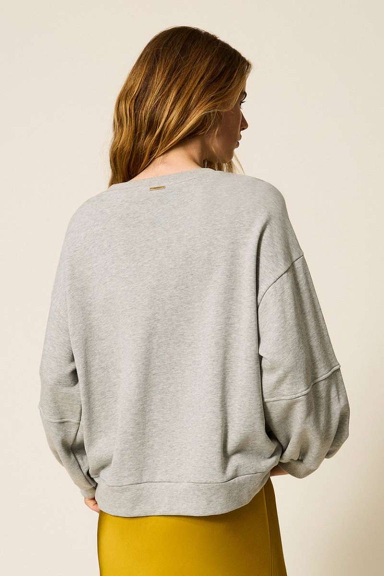 Felpa con catene di strass e perle